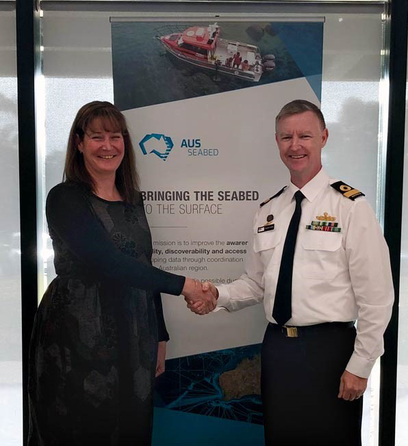 Commodore Stewart Dunne RAN, Hydrographer of Australia representing the Australian Hydrographic Office, and Maree Wilson, Branch Head National Earth and Marine Observations representing Geoscience Australia, at the signing of the AusSeabed Collaborative Head Agreement